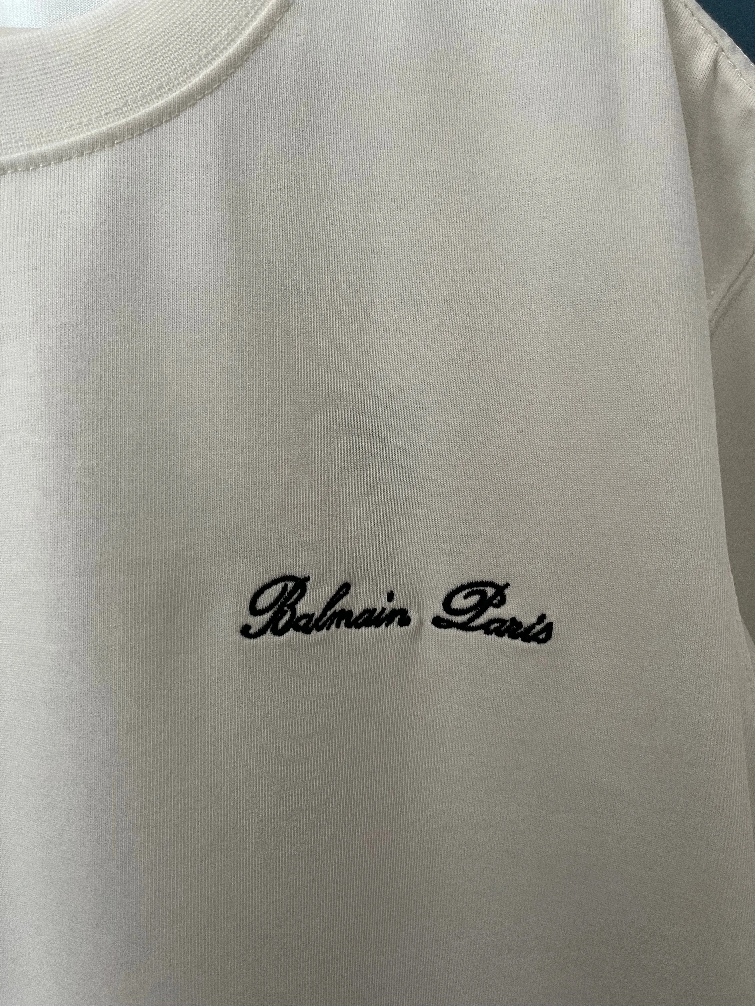 Balmain "Signature Logo Embroidered" T-Shirt styled in White for Spring/Summer 2024