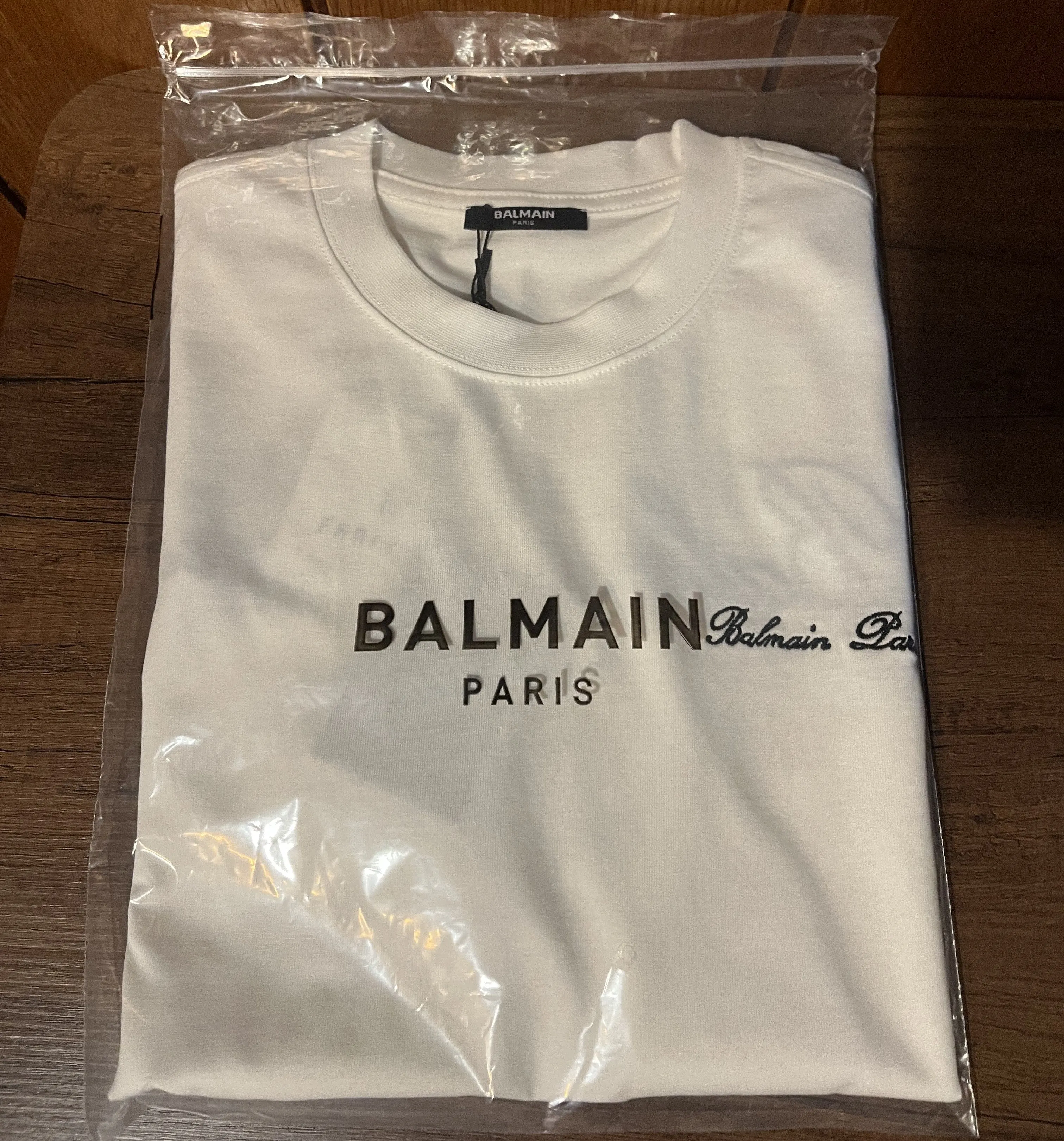 Balmain "Signature Logo Embroidered" T-Shirt styled in White for Spring/Summer 2024