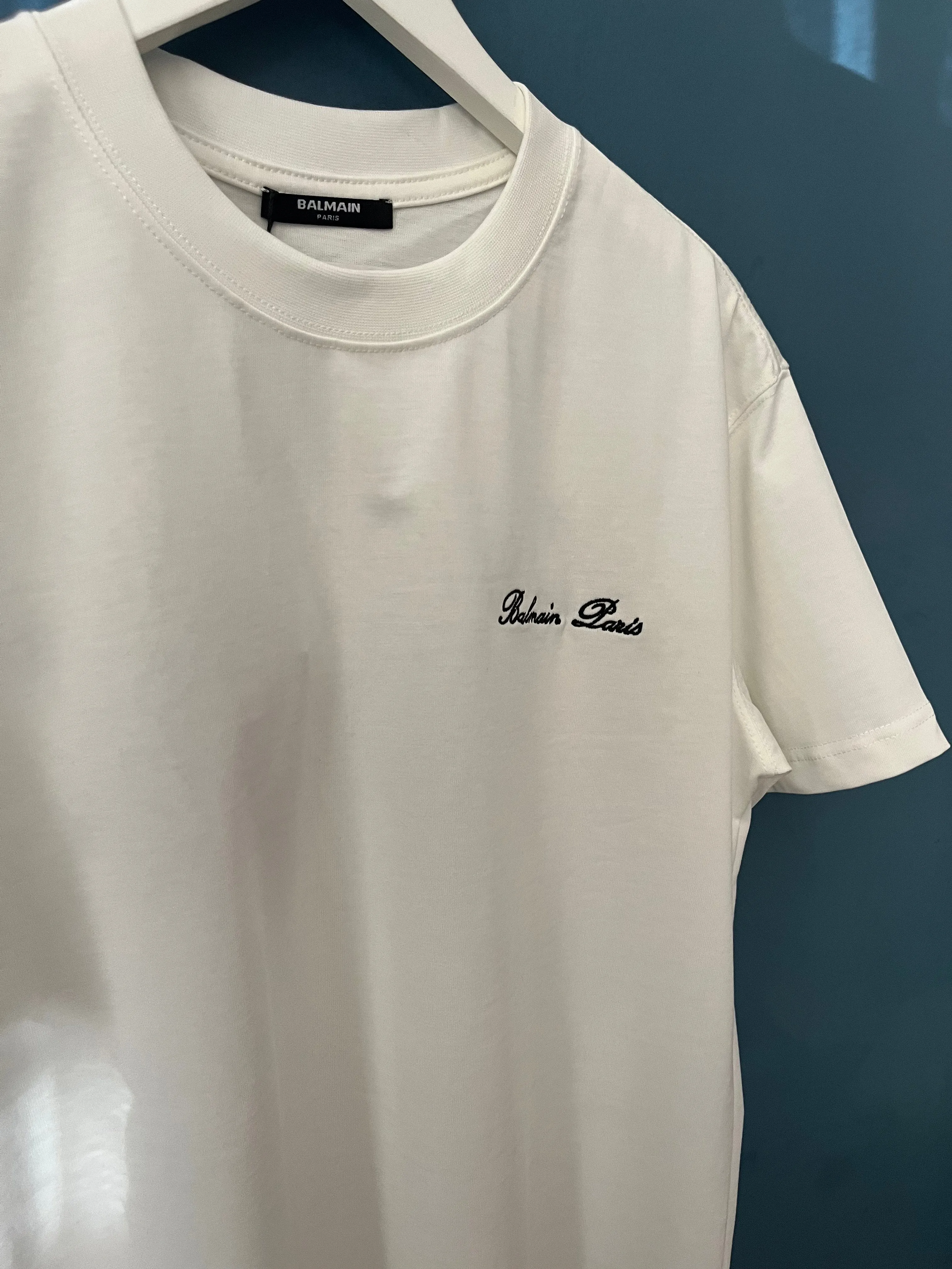 Balmain "Signature Logo Embroidered" T-Shirt styled in White for Spring/Summer 2024