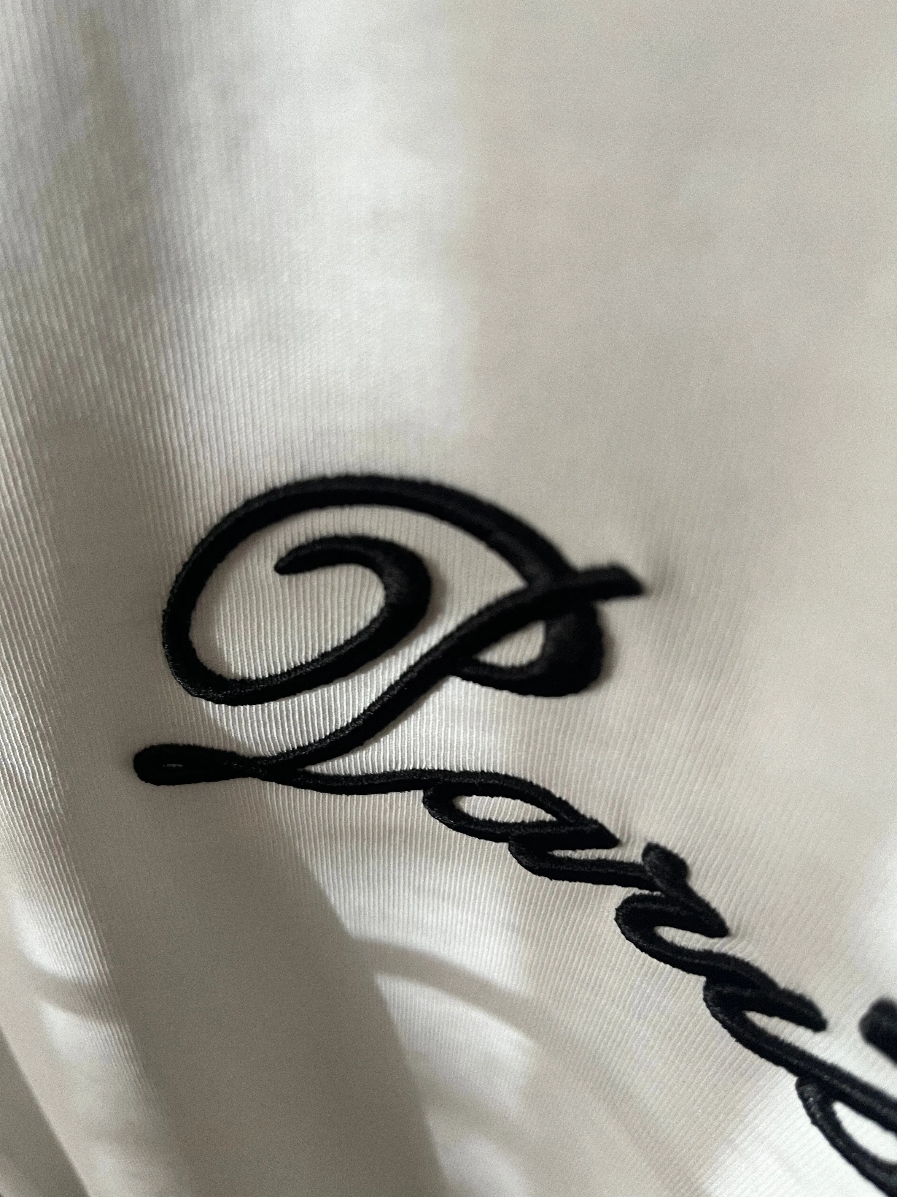 Balmain "Signature Logo Embroidered" T-Shirt styled in White for Spring/Summer 2024