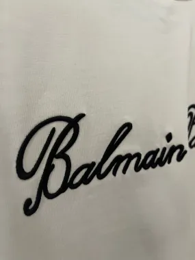 Balmain "Signature Logo Embroidered" T-Shirt styled in White for Spring/Summer 2024