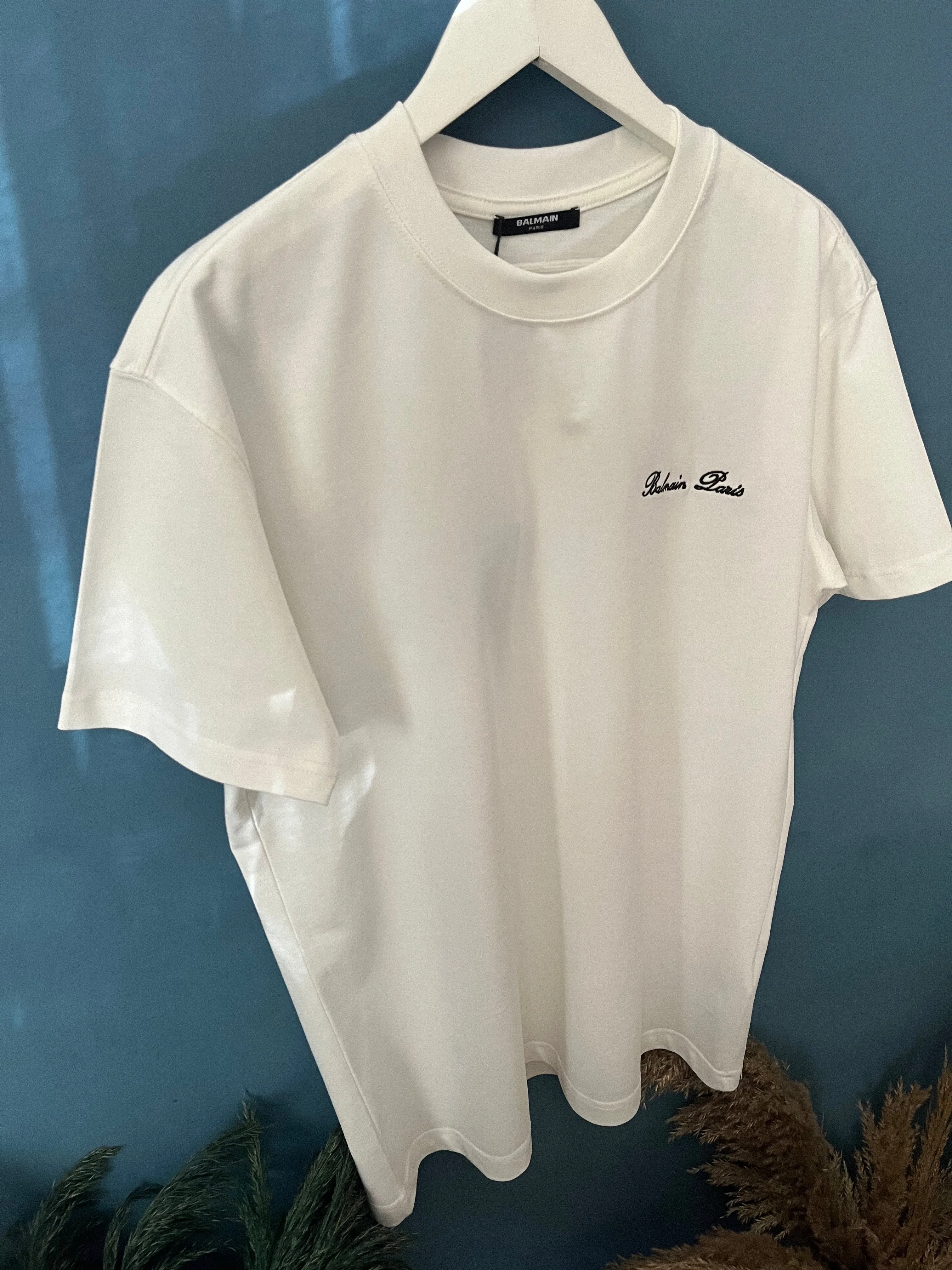 Balmain "Signature Logo Embroidered" T-Shirt styled in White for Spring/Summer 2024