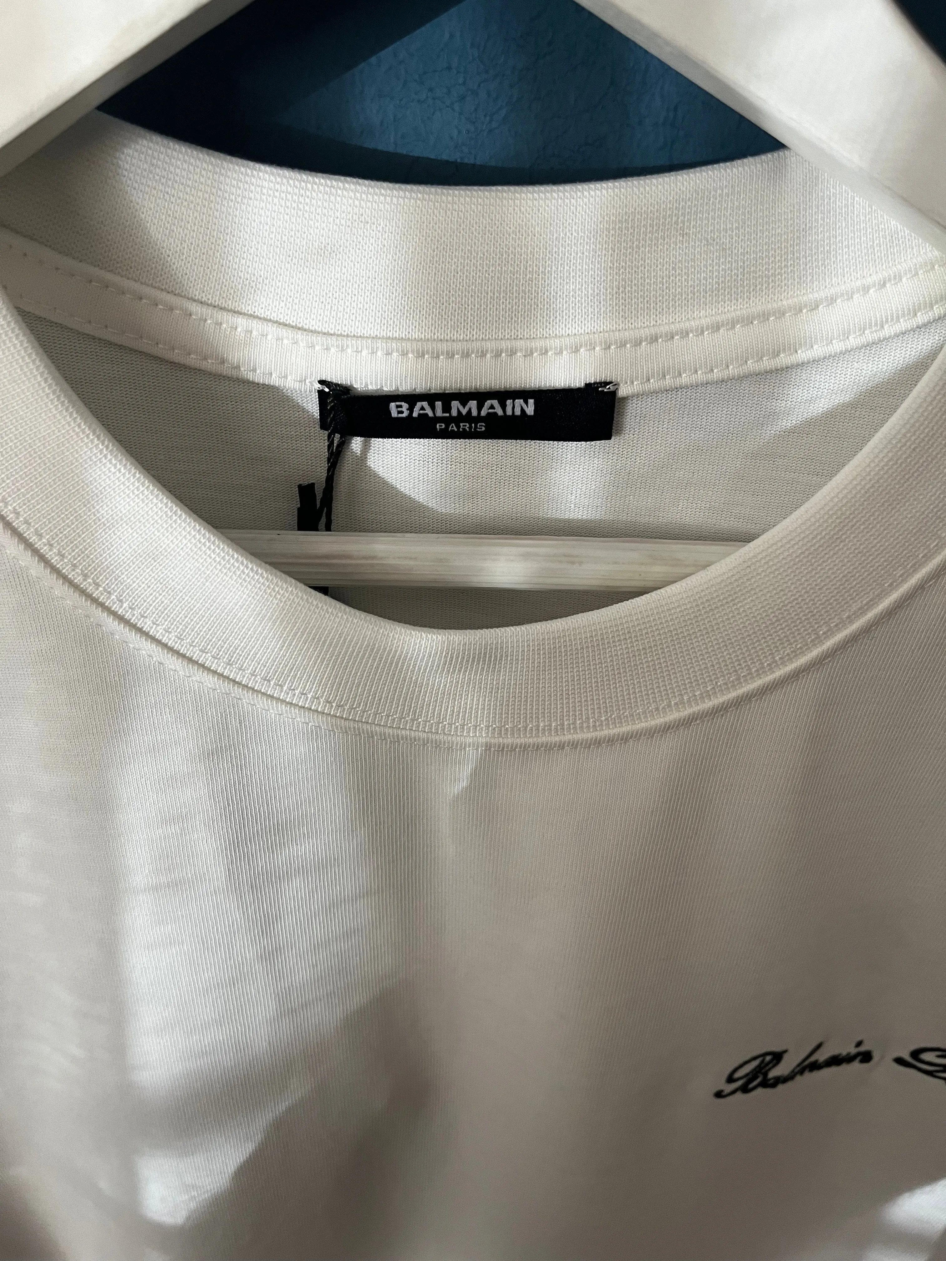 Balmain "Signature Logo Embroidered" T-Shirt styled in White for Spring/Summer 2024